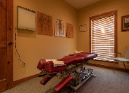 Chiropractic treatment room and adjustment table at Thomas Chiropractic and Spinal Decompression in Stephenville, TX